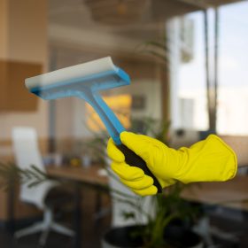professional-cleaning-service-person-cleaning-office-window
